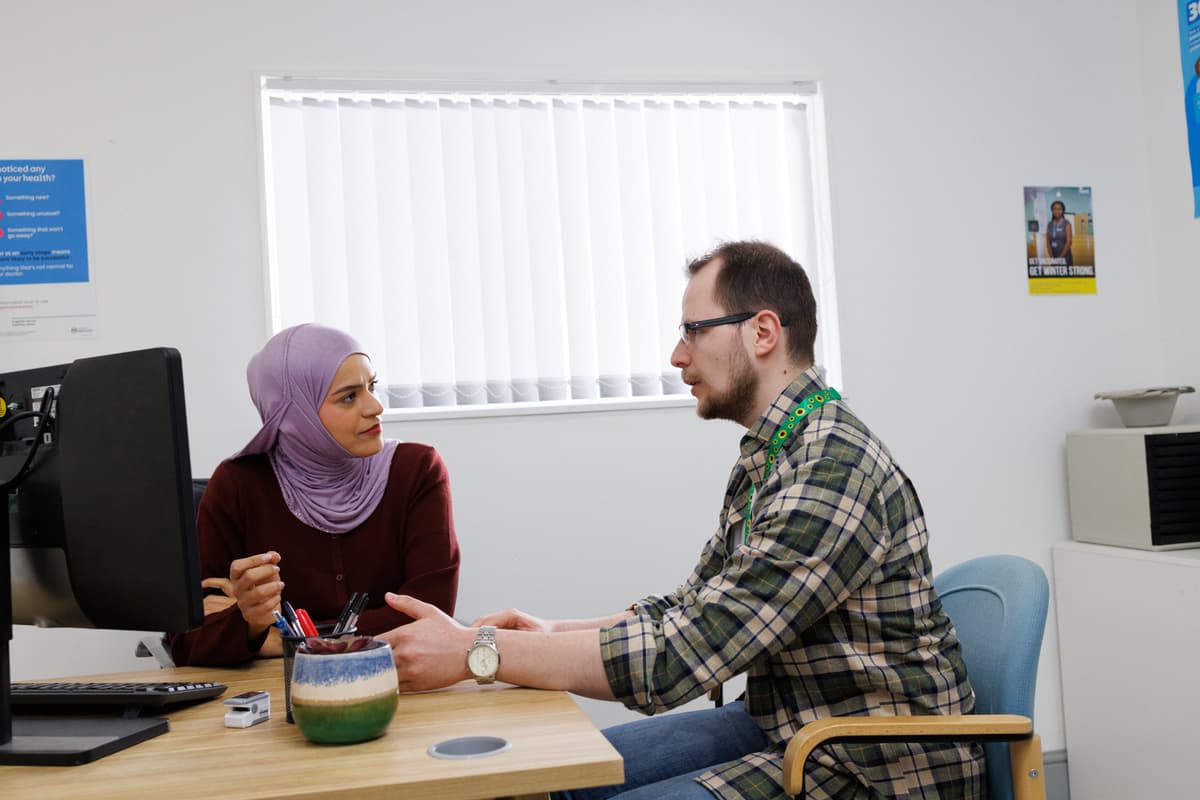 Doctor discussing symptoms with the patient.