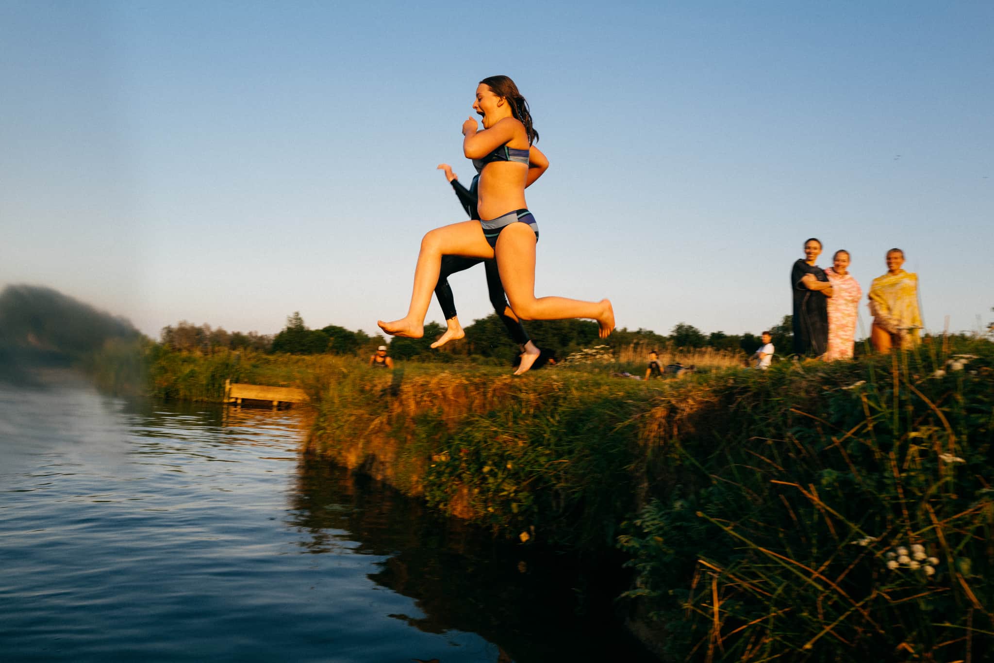 Shots of friends swimming in the wild greens.