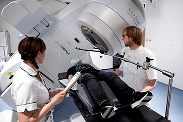 Photo of a child wearing a radiotherapy mask having brain radiotherapy.