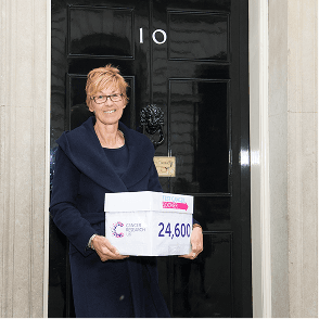 A photo of a Campaigns Ambassador in front of 10 Downing Street.