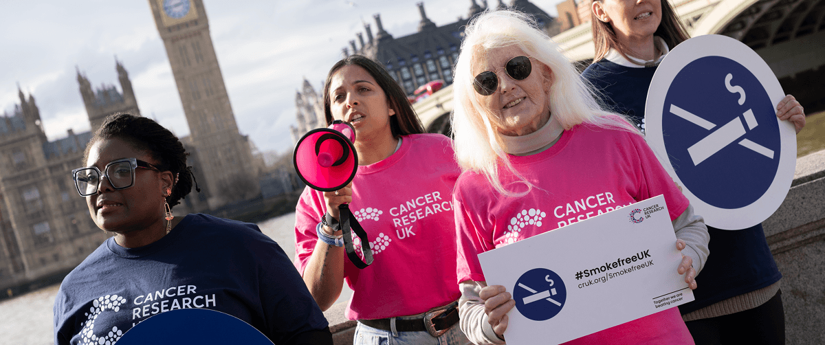 Four Campaign Ambassadors of various ages and ethnicities are standing opposite the Houses of Parliament.
