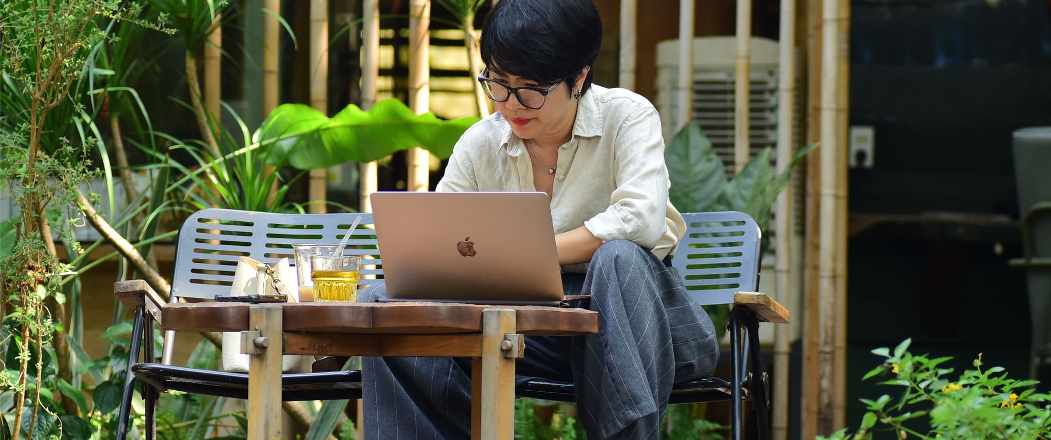 Woman reading laptop.