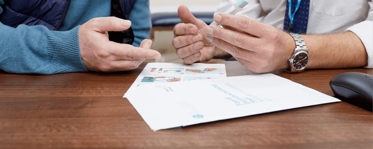 Dr and a patient looking at FIT test.