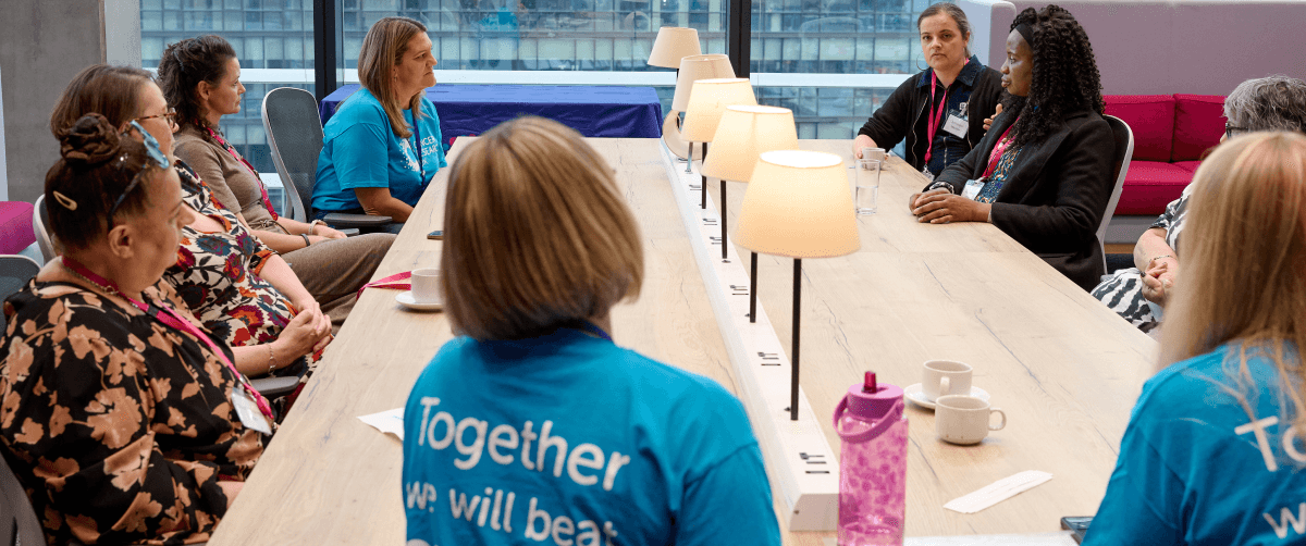 A photo of two Cancer Insights Panel member talking.