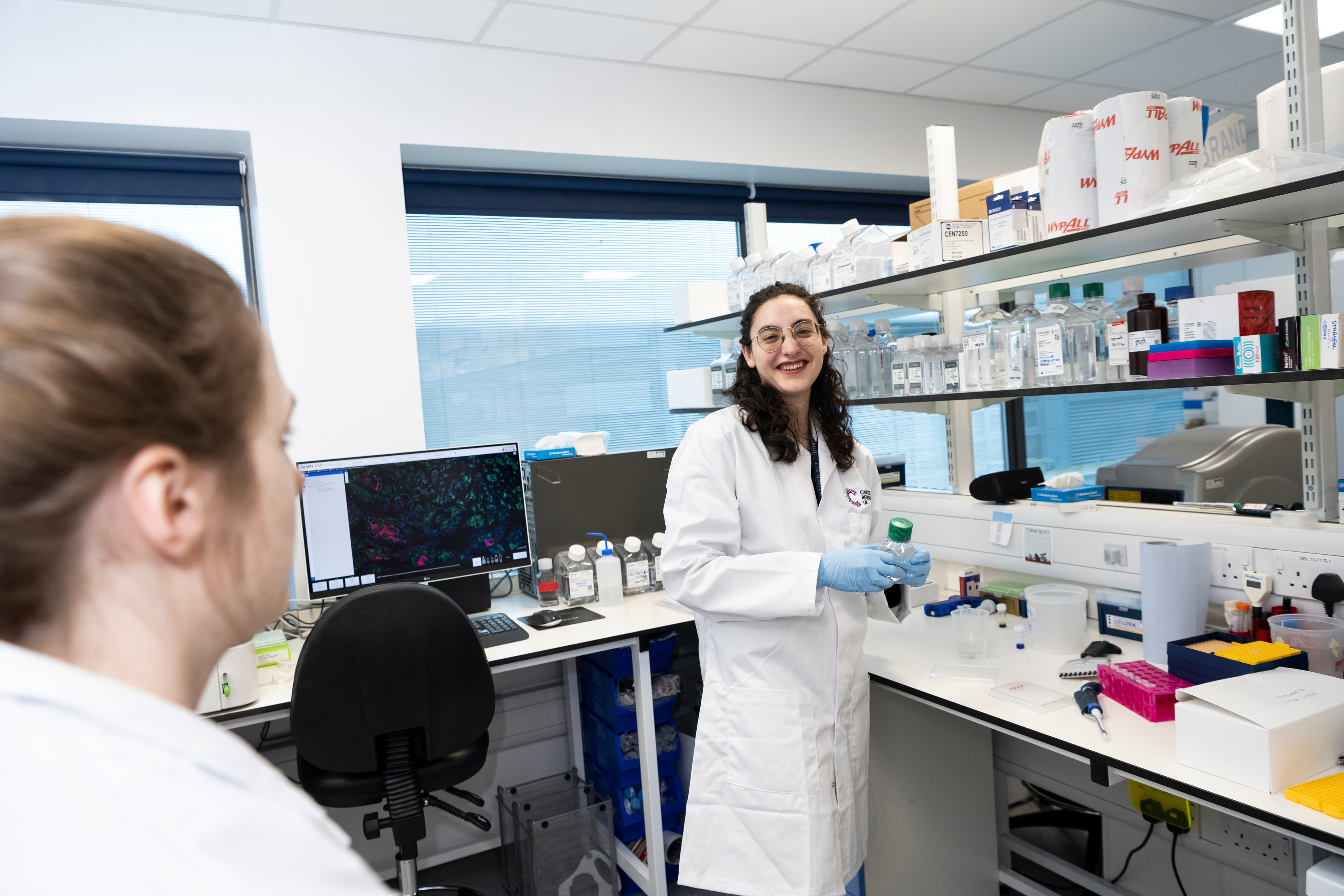 A photo of a researcher in a lab.