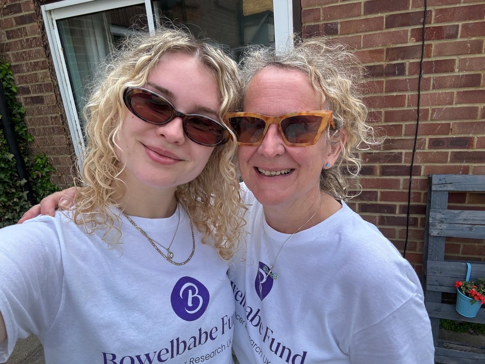 Picture of a mother and daughter wearing Bowelbabe Funs t-shirts.