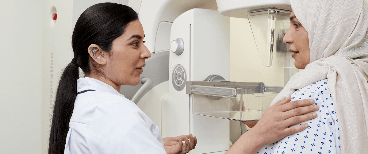 A photo of a health professional together with a patient.